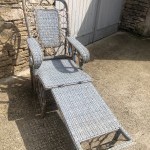 Old garden deck chair, winter garden.