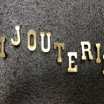 Old small letters jewelry store sign.