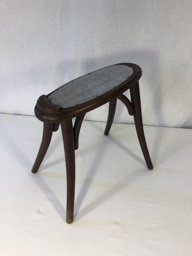 Old shoeshine or shoemaker's stool.
